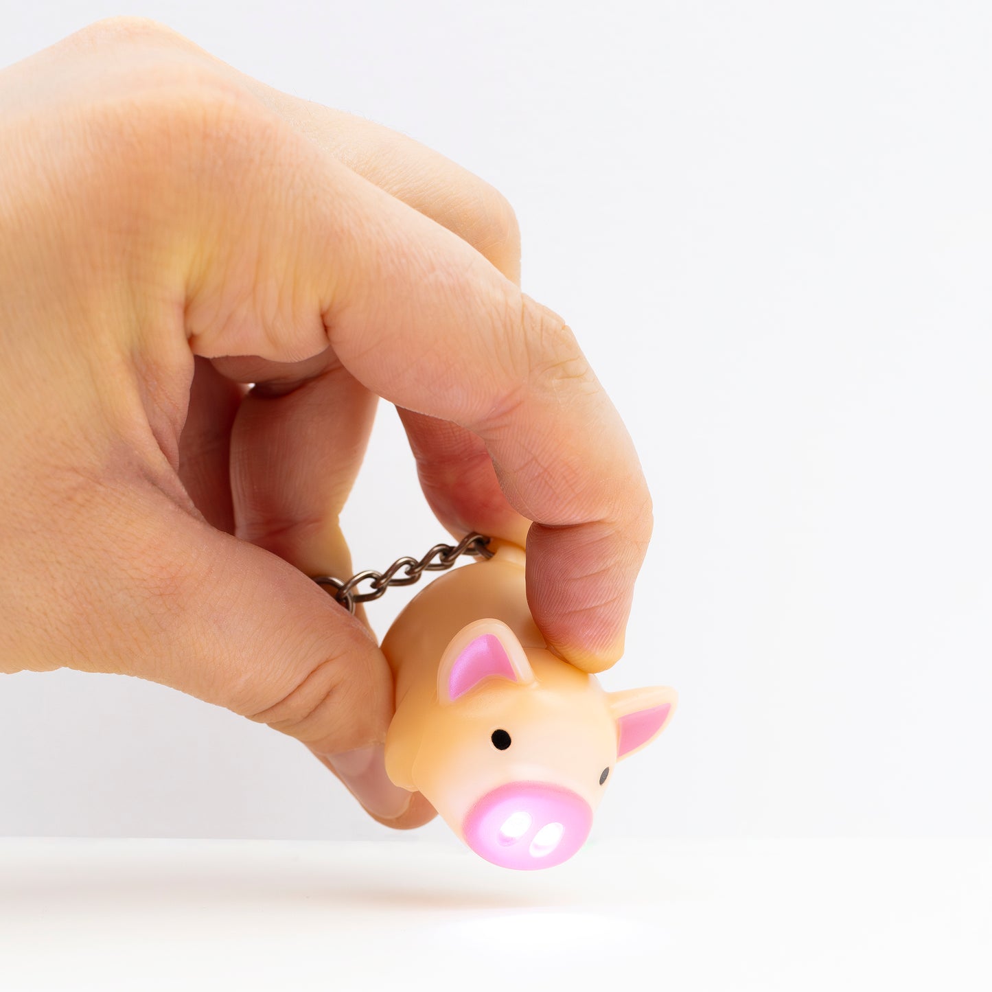 Piggy keychain with flash light on