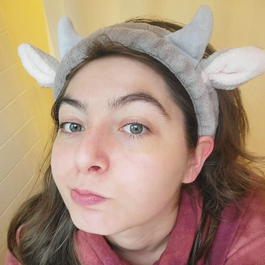 Cute cow headband shown on a person