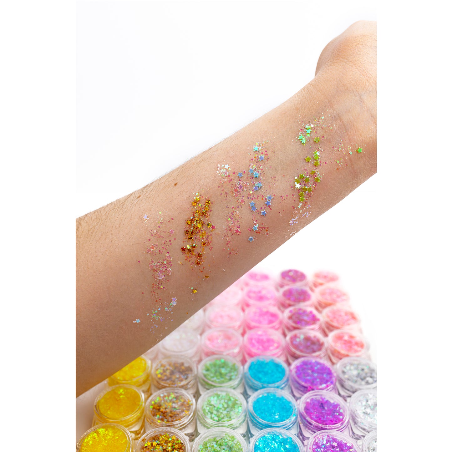 Swatches of the body glitter gel on a person's arm