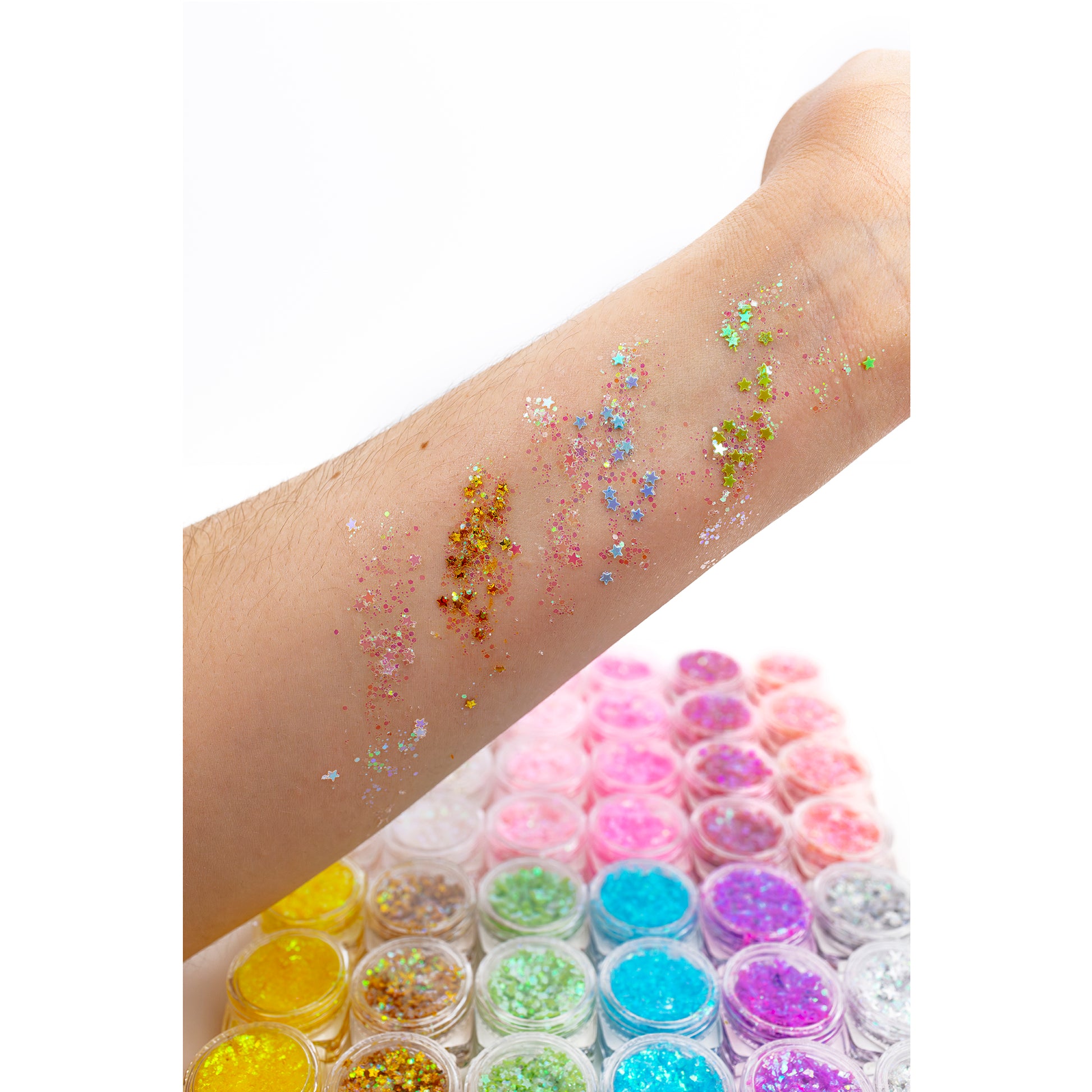 Swatches of the body glitter gel on a person's arm