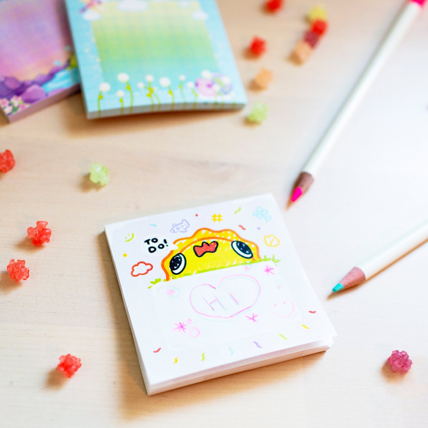 Kawaii stationery with anime sunshine and the word hi written on it